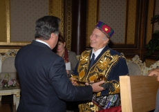 His Excellency President Emomali Rahmon presents Mawlana Hazar Imam with a gift of traditional Tajik garments.  