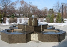 A fountain trickles in the garden outside the Jamatkhana.   