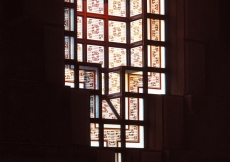 The opalescent cast-glass windows in the Prayer Hall are decorated with stained geometric patterns.