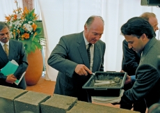 Mawlana Hazar Imam applies cement to brick as part of the Foundation Ceremony of the Ismaili Centre, Lisbon.