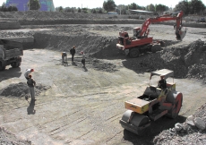 November 2005: Heavy tractors and bulldozers are used to grade and compact the site.