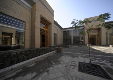 The Great Courtyard with the Social Hall Portal on the left and the Prayer Hall portal on the right. A reflection of the Youth and Education Portal is visible in the window of the Social Hall.