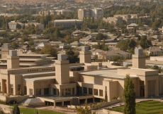 An aerial view of the complex shows the Main Entrance on the right, the Social Hall Entrance on the left and one of four corner water features in the middle.