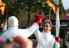 Torch bearer Ali Nanji receives a high-five at the start of his run.