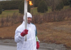 Hafeez Kassam carried the Olympic flame in the town of Grand Falls, New Brunswick.