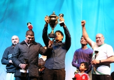 Traditional Volleyball winners celebrate their trophy.