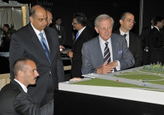 Prince Rahim gets an eye-level look at the architectural model, as Ismaili Council for Ontario President Karim Sunderji, AKTC General Manager Luis Monreal and landscape architect Vladimir Djurovic look on.