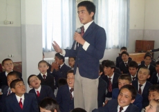 A volunteer takes part in a question and answer session during Volunteer Week in Kabul.