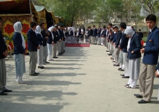 Volunteers line up to welcome Jamati and institutional leaders at Umomi Jamatkhana at the conclusion of Volunteer Week in Afghanistan.