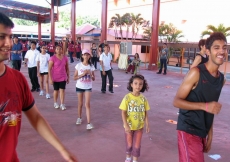 Participants join in a warm-up session ahead of the Sports Day&amp;rsquo;s main events.