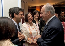 Mawlana Hazar Imam enjoys a light moment with Jamati leaders, who were attending a tea party with Prince Charles in commemoration of the 25th anniversary of the Ismaili Centre, London.