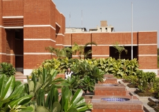 A view of the verdant fore court with fountains.