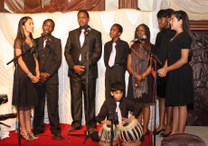 Students from the Aga Khan Academy, Nairobi perform an interfaith chant before Mawlana Hazar Imam at the Kenya Jamati Institutional Dinner.