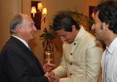 Mawlana Hazar Imam with music artists Salim and Sulaiman Merchant, who performed in his honour at the Kenya Jamati Institutional Dinner.