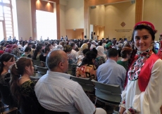 A volunteer celebrating Eid ul-Fitr with the rest of the Jamat in the auditorium of the Ismaili Centre, Dushanbe.