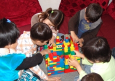 Three-year-olds play with universally loved blocks at Sparks Academy in Kabul.