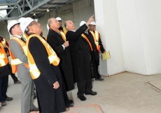 Mawlana Hazar Imam and Prince Amyn in the prayer hall of the Ismaili Centre, Toronto, discussing design details of the mihrab.