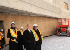 Mawlana Hazar Imam reviews landscape features at the entrance of the Ismaili Centre, Toronto.