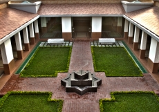 Functional areas of the building are arranged around the Centre Courtyard with the Social Hall on the right, the Administrative Corridor on the left, and the Prayer Hall in the front.