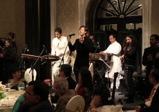 At the institutional banquet, musicians Salim and Sulaiman, accompanied by six youth from across India, perform before the Imam and the Jamati leadership.