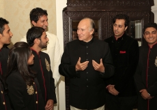 Mawlana Hazar Imam speaks with murids who performed at the institutional banquet.