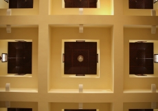 Chandeliers hang from a coffered ceiling inside the Ismaili Jamatkhana and Centre, Kinshasa.