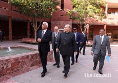 Mawlana Hazar Imam observes the CIME courtyard during a walkabout.