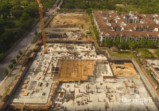 Site view looking north – mat slab under building complete, lower level deck progressing.