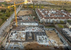 Site view looking north – mat slab under building complete, lower level deck progressing.