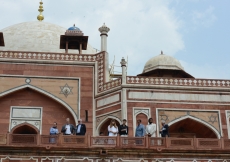 Princess Zahra, her daughter Sara and Prince Aly Muhammad take in a view of the gardens surrounding Humayun’s Tomb, together with AKTC staff, during a visit in 2015.