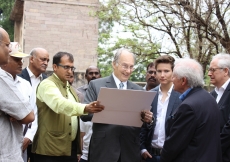 Mawlana Hazar Imam is shown archival photographs of the Tomb of Ibrahim Qutb Shah as Prince Aly Muhammad looks on. AKDN / Lipi Bharadwaj