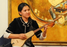 Janara Seitkulova plays traditional Kyrgyz folk music on the komuz. Rozina Sarasiya