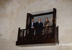 His Highness the Aga Khan together with Prince Rahim and Princess Zahra overlooking the entrance hall of the Ismaili Centre Dubai from the balcony above.