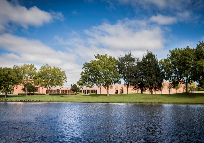 The Ismaili Jamatkhana and Centre, Houston, with a view of the gardens and the lake.