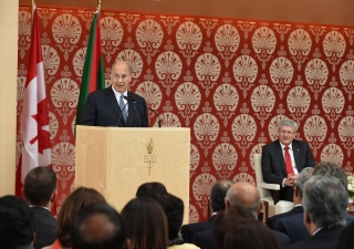 Mawlana Hazar Imam speaks at the opening of the Ismaili Centre, Toronto, as the Canadian Prime Minister looks on. Gary Otte