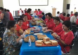 Volunteers made about 2,800 peanut butter and jelly sandwiches for the Calgary Drop-In & Rehab Centre on Sunday.