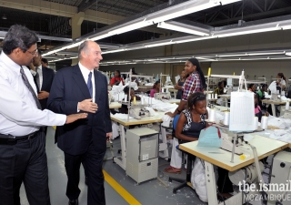 His Highness the Aga Khan takes a tour of Moztex garment manufacturing industry, which trains and employs women.