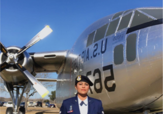 In full uniform, Zehra poses on base after being recruited into the army.