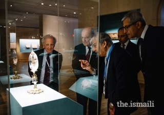 Curator, Dr. Assadullah Souren Melikian-Chirvani, shows an artefact to Prince Amyn, AKDN Resident Representative to Canada Dr. Mahmoud Eboo, Aga Khan Trust for Culture General Manager Luis Monreal, and Ismaili Council for Canada President Malik Talib.