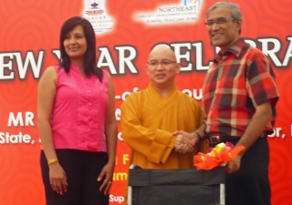 His Excellency Zainul Abidin Rasheed and Presidentbanoo Karam Bana present a wheelchair to a social welfare group representative. 