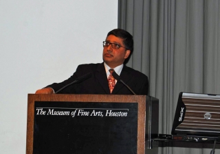 Alnoor Merchant addresses the audience at the Museum of Fine Arts in Houston.