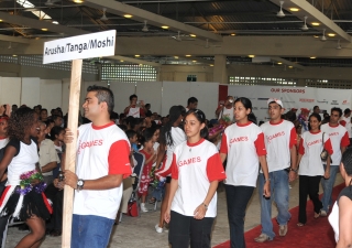 Participants parade into the Diamond Jubilee Hall in Dar es Salaam during the opening ceremony of the 2009 Unity Games.