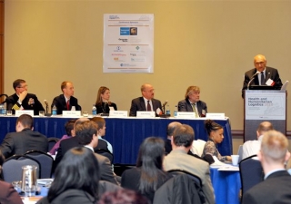 FOCUS International Coordinator Gulam Juma delivers his presentation at a panel discussion on “Education, Community Preparedness and Capacity Building.”  From right to left: Bernard Chomilier, World Food Programme; Dale Herzog, United Parcel Service and C