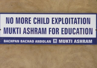 A sign posted at an Ashram run by an Indian NGO that helps child labourers decries child exploitation.