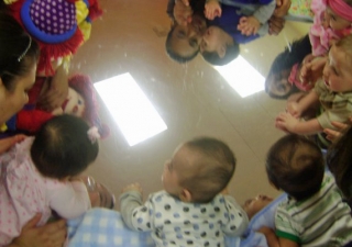 Little toddlers meet and make friends on the first day of school.