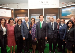 Jamati volunteers and representatives from AKF USA and FOCUS North America gather with Prince Hussain, Governor Schwarzenegger and his wife in front of the AKDN information booth at the Governors’ Global Climate Summit 3, which was hosted at the Universit