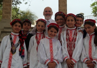 The Tajik students together with Les Wilkins, the Head of the Junior School, dressed in traditional Pamiri outfits for the Junior School Assembly celebrating Navroz.