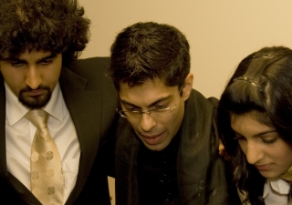 Hussein Janmohamed (centre) in a pre-show huddle with members of the Canadian Ismaili Muslim Youth Choir at a performence in Edmonton.