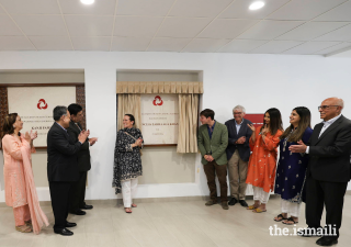 Princess Zahra and her son Iliyan reveal a plaque to commemorate the official opening of the Aga Khan Health Centre in Aliabad.