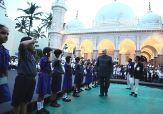 Mawlana Hazar Imam inspects Ismaili Bulbuls and Cubs standing at attention in the compound of Hasanabad in Mazagaon — the burial place of the 46th Ismaili Imam, Hazrat Aga Hasan Ali Shah, Aga Khan I.